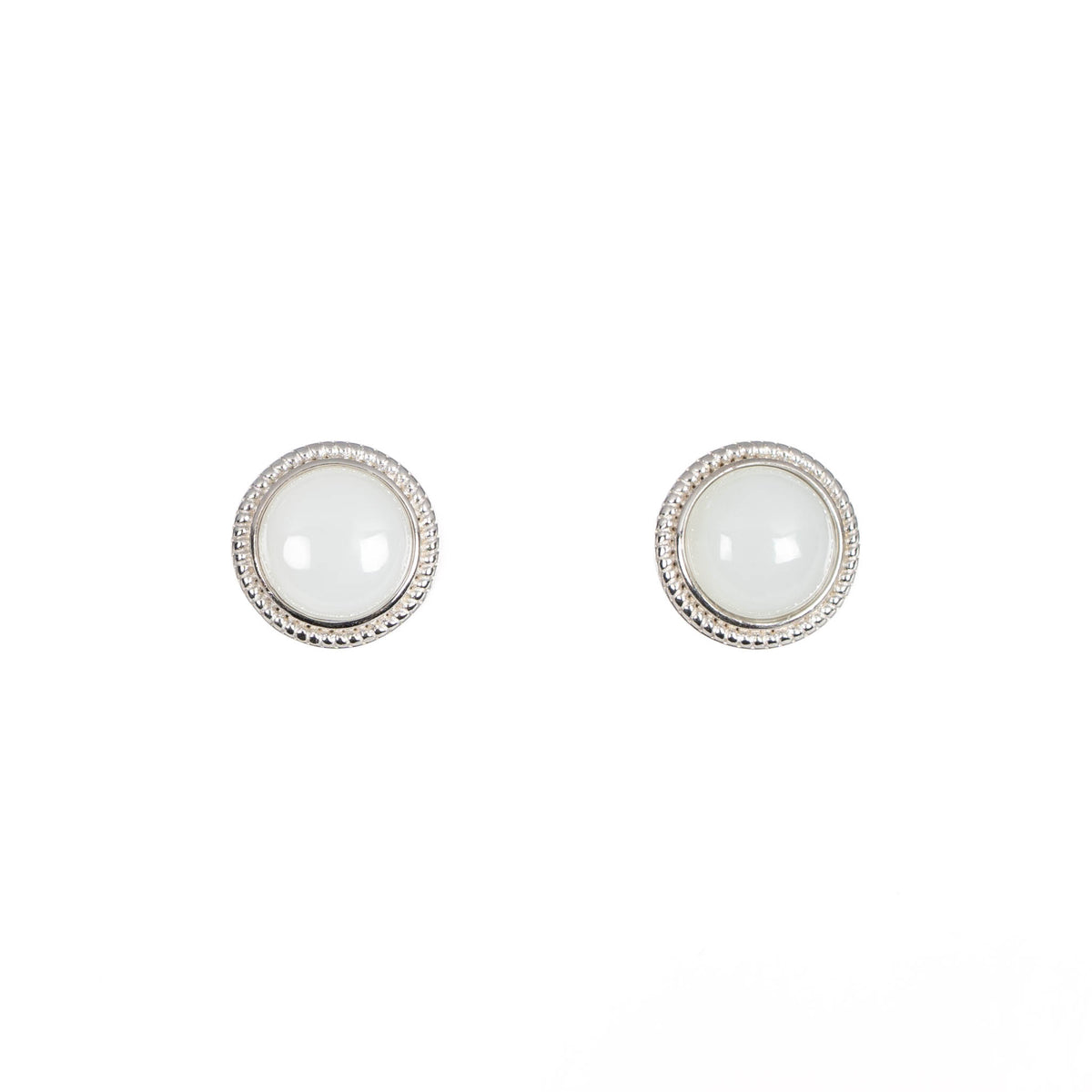A pair of white jade round stud earrings in sterling silver with milgrain edge detailing.