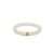 A bracelet featuring white mutton fat jade beads with a gold or silver accent, displayed on a white background.