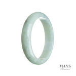 A pale green jadeite jade bangle with a half moon shape, measuring 60mm in size.