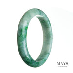A close-up image of a beautiful green bangle bracelet made from certified natural Burmese jade. The bracelet is in the shape of a half moon and has a diameter of 68mm. It is a stunning piece of jewelry from the MAYS™ collection.