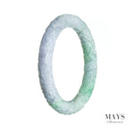 A lavender and green jade bangle with intricate carvings, perfect for adding a touch of elegance and tradition to any outfit.