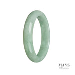 A light green traditional jade bangle with a half moon design, measuring 59mm. This genuine Type A jade piece is offered by MAYS GEMS.