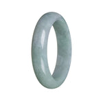 A light green Burma jade bangle with a half moon design, made of genuine Grade A jade.