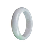 A close-up image of a delicate jadeite bracelet with a half-moon shape. The bracelet features real untreated lavender and a small green section, adding a touch of natural beauty.