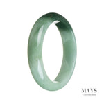 A close-up image of a green and dark green jade bangle with a half-moon shape, showcasing its natural beauty and authenticity.