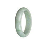 A half-moon shaped bangle bracelet made from genuine, natural white Burmese jade with hints of green.