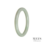 A close-up photo of a genuine untreated pale green jade bangle bracelet. The oval-shaped bracelet has a 58mm diameter and features a smooth and polished surface. The pale green color of the jade is soothing and elegant. The bracelet is of high quality and is made by MAYS™.