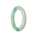 A close-up image of an exquisite jade bangle bracelet. The bracelet features a round shape with a 56mm diameter. The jadeite jade is a stunning shade of white with beautiful emerald green accents. This high-quality, authentic piece is from the MAYS™ collection.