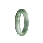 A close-up photo of a half-moon shaped jade bangle in vibrant green with white streaks. It is certified as untreated and made of high-quality jadeite jade.