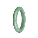 A stunning light green jade bangle bracelet with a mottled pattern. This authentic Grade A piece is crafted in a traditional style and measures 59mm in a semi-round shape. Perfect for adding a touch of elegance to any outfit. From the MAYS™ collection.