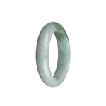 Close-up of a half-moon shaped bracelet made of certified untreated white Burmese jade. The jade has a beautiful olive green hue, adding a touch of elegance and uniqueness to the piece. The bracelet measures 52mm in diameter. Crafted with precision and care, this MAYS™ bracelet is a stunning addition to any jewelry collection.