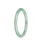 A petite round light green jadeite bangle with a genuine grade A quality, measuring 60mm.