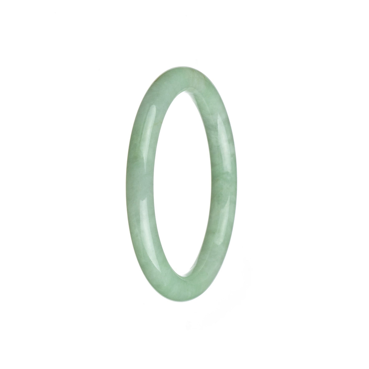 A small round light green Burmese jade bangle, untreated and natural.
