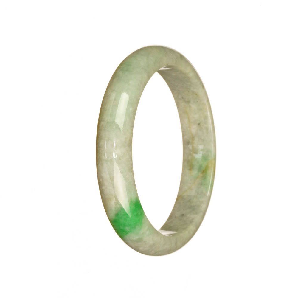 A close-up photo of a stunning jadeite jade bangle bracelet. The bracelet is made of Grade A grey jade with beautiful emerald green hues. It features a smooth half-moon shape and measures 51mm in diameter. A high-quality piece from MAYS GEMS.