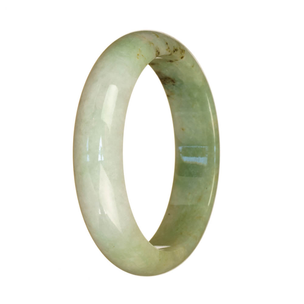 A half moon-shaped jade bracelet featuring a natural untreated green and white pattern from Burma.