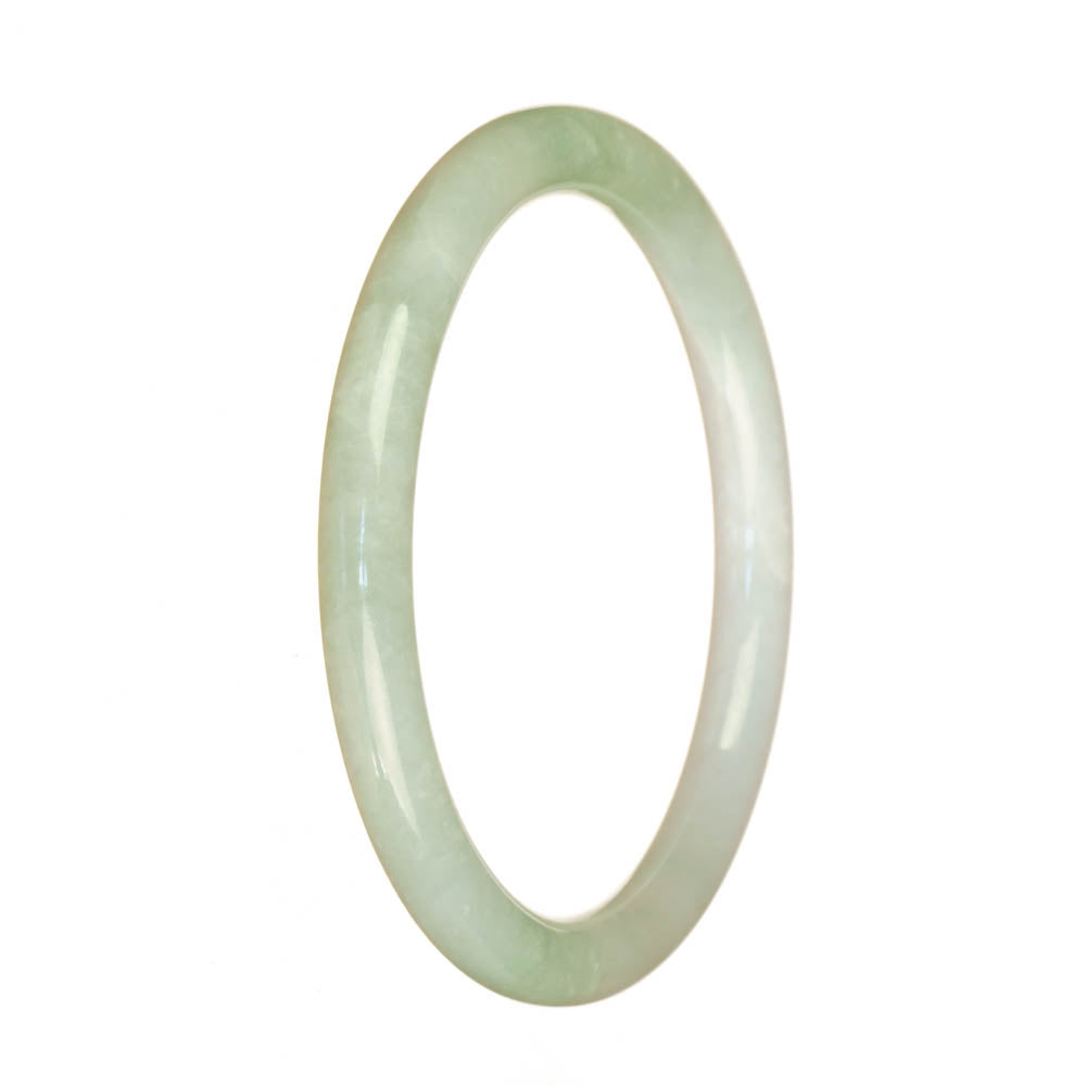 A close-up image of a delicate round white jade bracelet, measuring 60mm in size. The bracelet is made from genuine Grade A white jade, showcasing its smooth and polished surface. The natural beauty of the jade is highlighted, reflecting light and exuding elegance. This petite round bracelet is a timeless piece of jewelry, perfect for adding an understated touch of luxury to any outfit.
