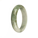 A close-up image of an elegant jade bangle bracelet with a white base and a beautiful green pattern. The bracelet is made of authentic Type A Burma Jade and has a unique 56mm half moon shape. Perfect for adding a touch of sophistication to any outfit.