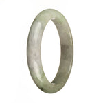 A beautiful half moon shaped Burma Jade bangle with a unique greyish lavender and green coloration.