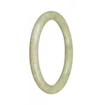 A small, round, light green Burma Jade bangle with an authentic, untreated appearance.