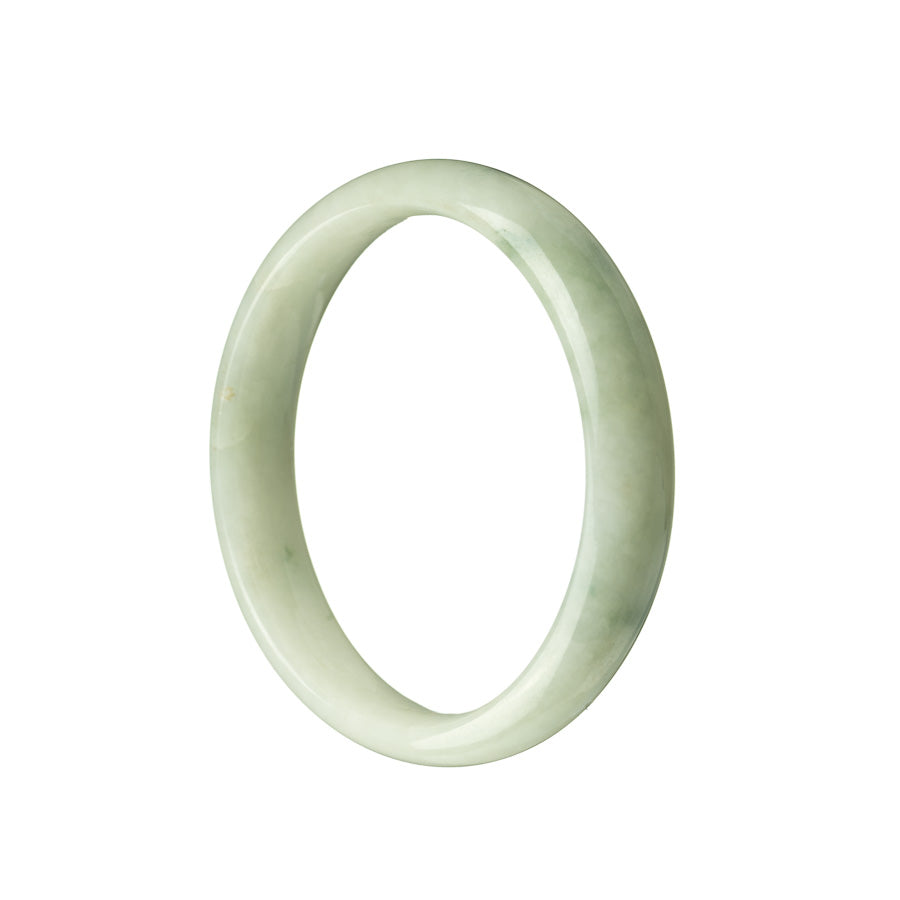 Close-up of a half-moon-shaped green and white jadeite bracelet, showcasing its genuine and natural beauty.