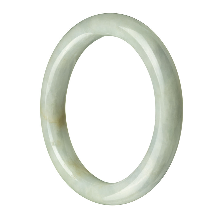 Close-up image of a beautiful pale green jade bangle with a semi-round shape, showcasing its authentic natural texture and color. Perfect accessory to add a touch of elegance to any outfit.