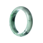 A close-up of a beautiful green Burma jade bracelet with a half moon shape, showcasing its genuine natural beauty. Perfect for adding a touch of elegance to any outfit.