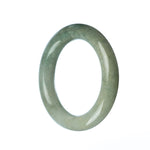 A round, 54mm genuine Grade A Green Jadeite bangle with a beautiful, natural green color. Perfect for adding a touch of elegance to any outfit.