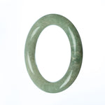 A round green jadeite jade bracelet with a 58mm diameter from MAYS GEMS.