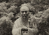 photo of a statue of Confucius in greyscale.
