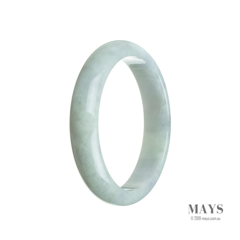 A delicate, half-moon shaped Burmese Jade bangle bracelet in a very pale green color with subtle hints of lavender. The bracelet is made from genuine and untreated jade, measuring 60mm in size. A beautiful and timeless piece from MAYS.