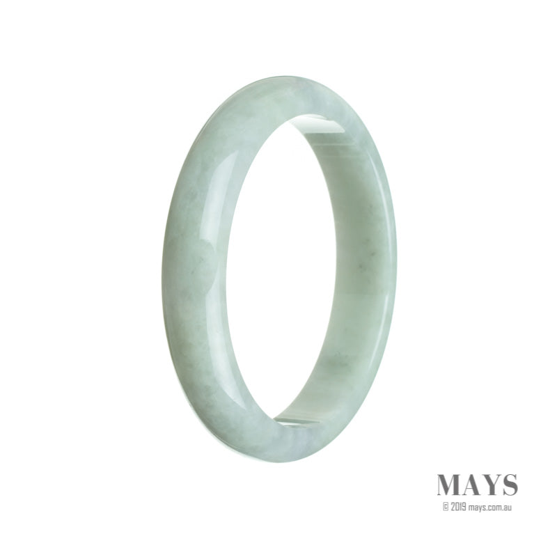 A close-up of a pale green jade bangle, shaped like a half moon, with a smooth and polished surface. The bangle has a rich and authentic appearance, showcasing the natural beauty of the high-quality jade.