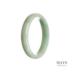A close-up image of a light green jade bracelet, carved in a half-moon shape, with a smooth and polished surface. The bracelet is made from genuine Type A jade and measures 55mm in diameter. Created by MAYS GEMS.