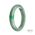 A close-up image of a genuine Grade A white with green jadeite bangle, measuring 64mm in a semi-round shape.