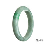 A close-up photo of a white and green jade bangle bracelet with a semi-round shape and a diameter of 64mm. The bracelet has a genuine Type A jade stone, known for its high quality and vibrant colors. It is a beautiful piece of jewelry from MAYS GEMS.