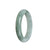 An elegant, untreated greish green jadeite jade bracelet, measuring 55mm in a semi-round shape. Expertly crafted by MAYS™.