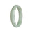 A light green jade bangle bracelet with a half moon shape, made from genuine Type A jadeite jade.