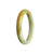 A close-up image of a brownish yellow jade bangle with a half moon shape, measuring 52mm in size. This genuine Type A jadeite jade bangle is showcased by MAYS GEMS.