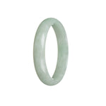 Close-up image of a light green traditional jade bangle bracelet with a half-moon shape, showcasing its authentic and untreated beauty.