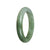 A beautiful 60mm semi-round green jadeite bangle, certified as Grade A quality.