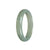 A half moon-shaped bangle bracelet made of genuine untreated green Burma jade, measuring 56mm. Designed by MAYS.