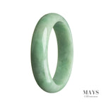 A stunning green Burma jade bracelet with a half moon shape, measuring 59mm.