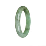 A close-up of a green jade bracelet with a semi-round shape, showcasing its natural beauty and traditional design.