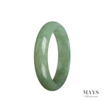 A half moon shaped green jadeite bracelet, handmade and crafted from real natural jade. The bracelet measures 55mm in diameter and is a stunning addition to any jewelry collection.