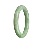 A round jade bangle with a natural green color, crafted in a traditional style.