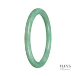 A close-up image of a bright green jade bangle bracelet with a petite round shape, made from high-quality Grade A jadeite. Perfect for adding a touch of elegance to any outfit.