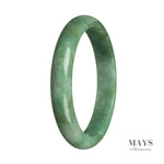 A close-up image of a real untreated green jade bangle bracelet. The bracelet is semi-round in shape and is 65mm in size. The jade stone has a smooth and polished surface, showcasing its vibrant green color and natural patterns. It is a stylish and elegant accessory that adds a touch of sophistication to any outfit.