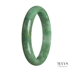 A close-up photo of a genuine natural green Burmese jade bracelet. The bracelet is semi-round and measures 65mm in diameter. It features a smooth and polished surface, showcasing the vibrant green color of the jade. The MAYS™ brand logo is visible on a small tag attached to the bracelet.