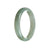 A light green traditional jade bangle bracelet with a half moon design, made of genuine Grade A jade.