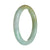 A beautiful jade bracelet with green and brown tones, featuring genuine Type A jadeite jade. The bracelet is semi-round in shape and measures 63mm in size. Made by MAYS.