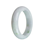 A close-up image of an authentic Type A Lavender with green spots Jadeite Jade Bangle Bracelet. The bracelet is in the shape of a half moon and has a diameter of 58mm.